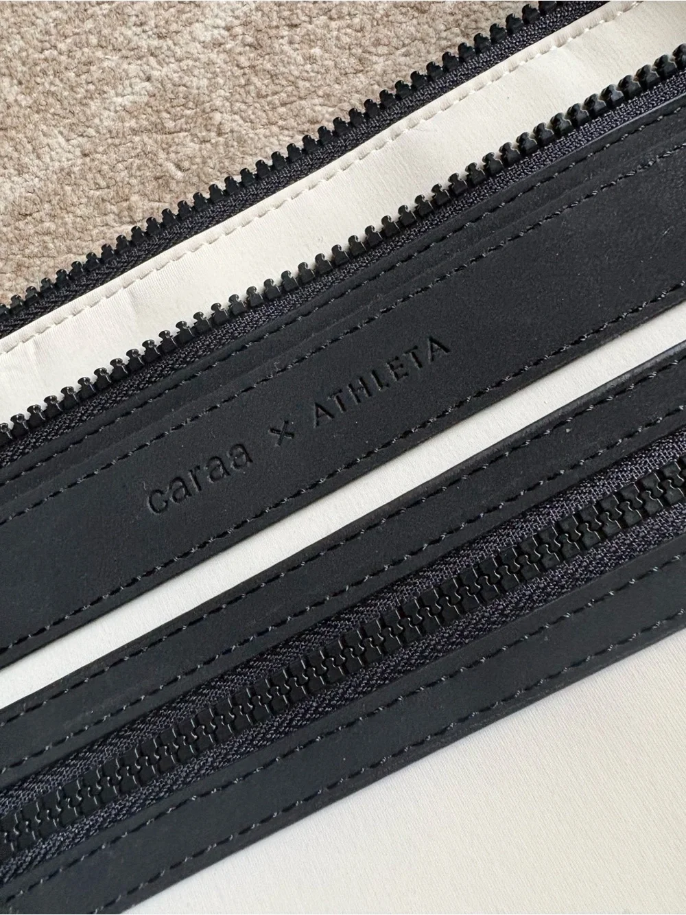 white and black Caraa x Athleta crossbody bag